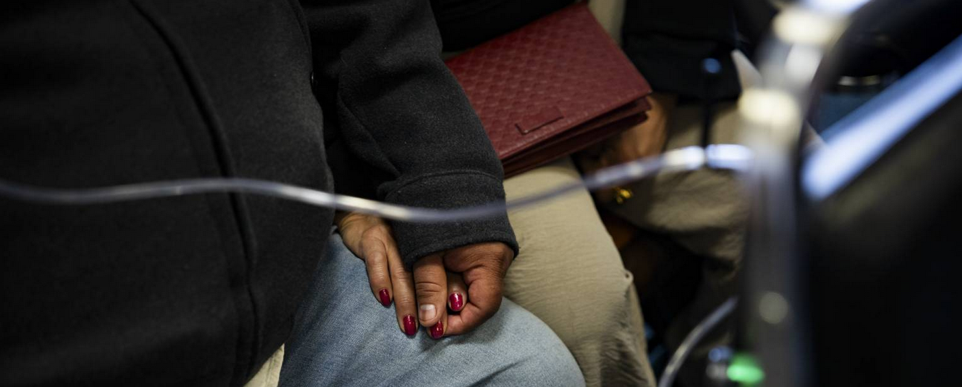 Picture of holding hands during hearing to ban artificial stone in California
