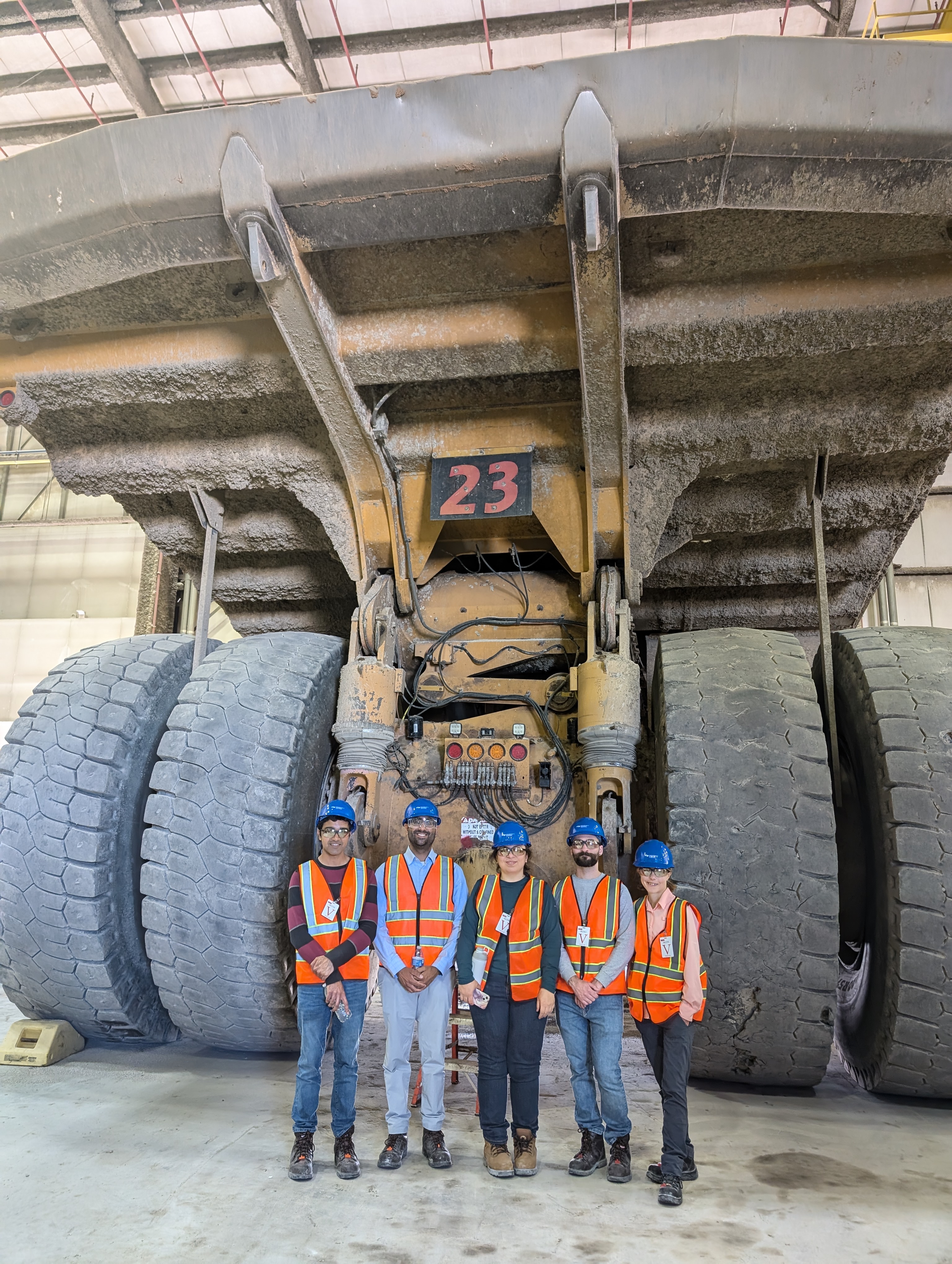 Resident standing in front of a quarry mining industrial vehicle